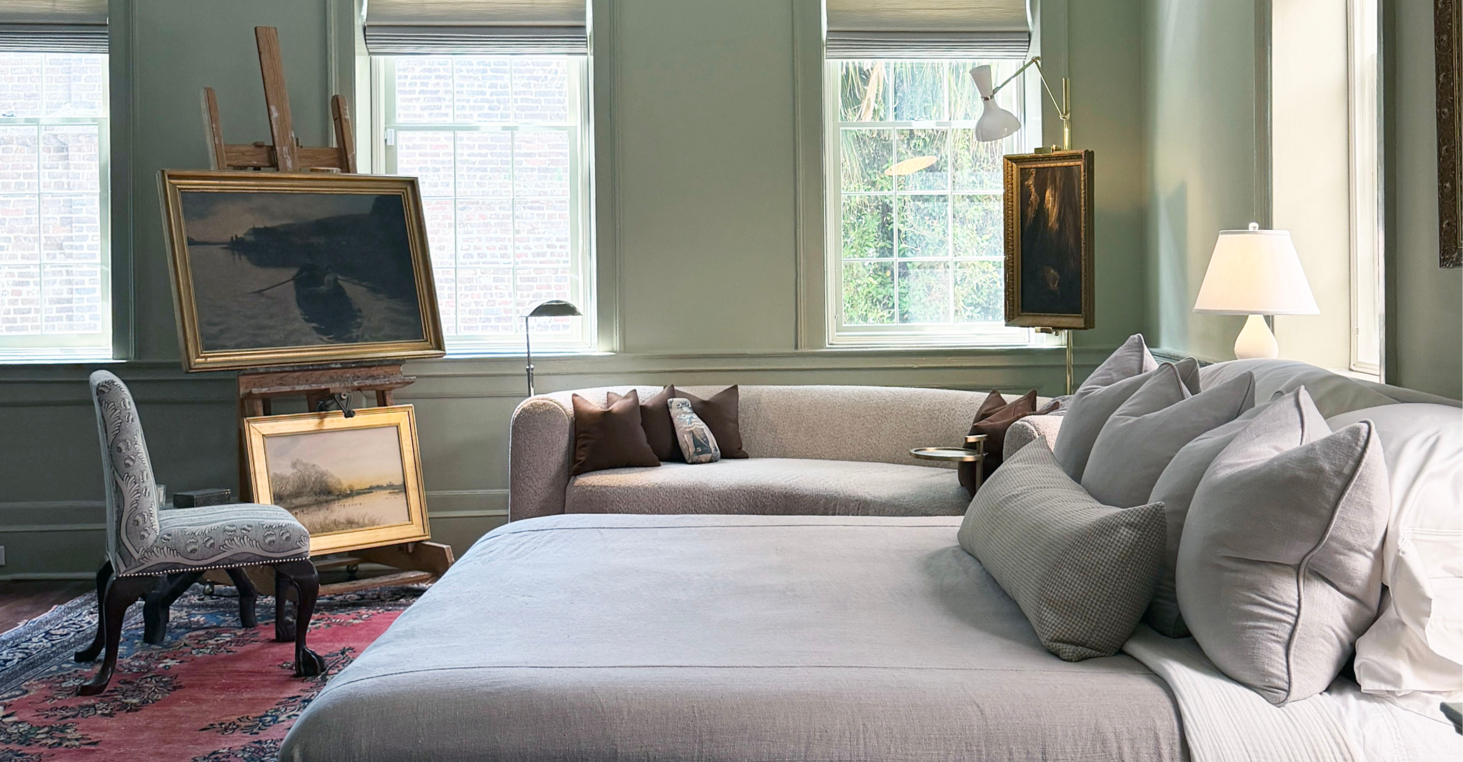 Robert Abbey Lighting illuminating a sage green primary bedroom in a historic Charleston home