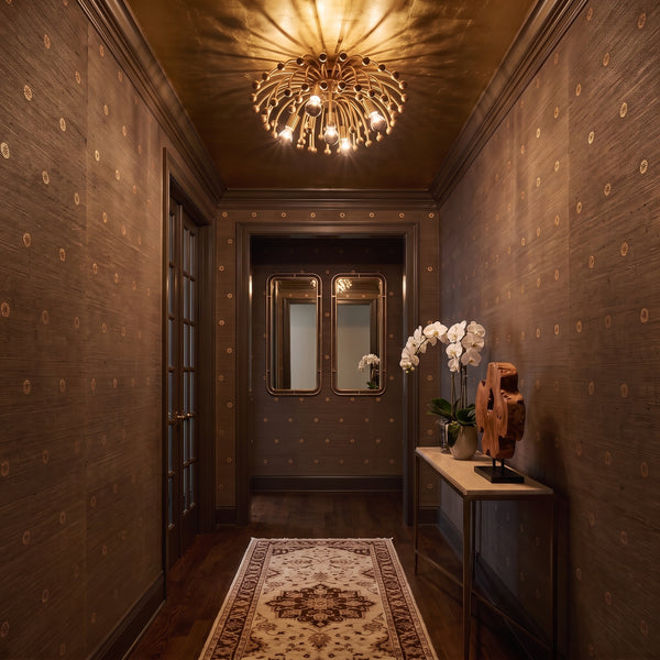 Anemone Flush Mount in Aged Brass on a hallway ceiling