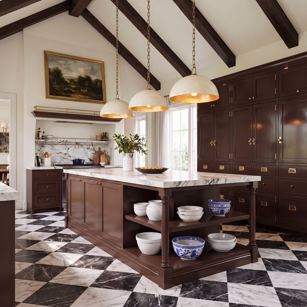 Three Anderson 18" Dome Pendants in Bone with brass hardware over a kitchen island