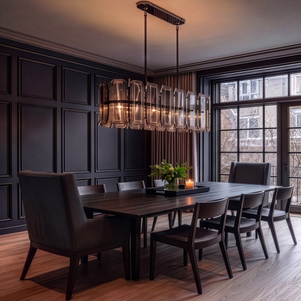 Gregory 47" Linear Chandelier in Blackened Polished Nickel over a dining table