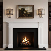 Gregory Wall Sconces in Blackened Polished Nickel flanking a fireplace