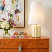 Edward Striped Ceramic Table Lamp in Butter on a burl chest