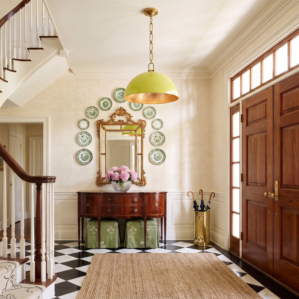 Anderson 18" Dome Pendant in Citron with brass hardware in an entry hall