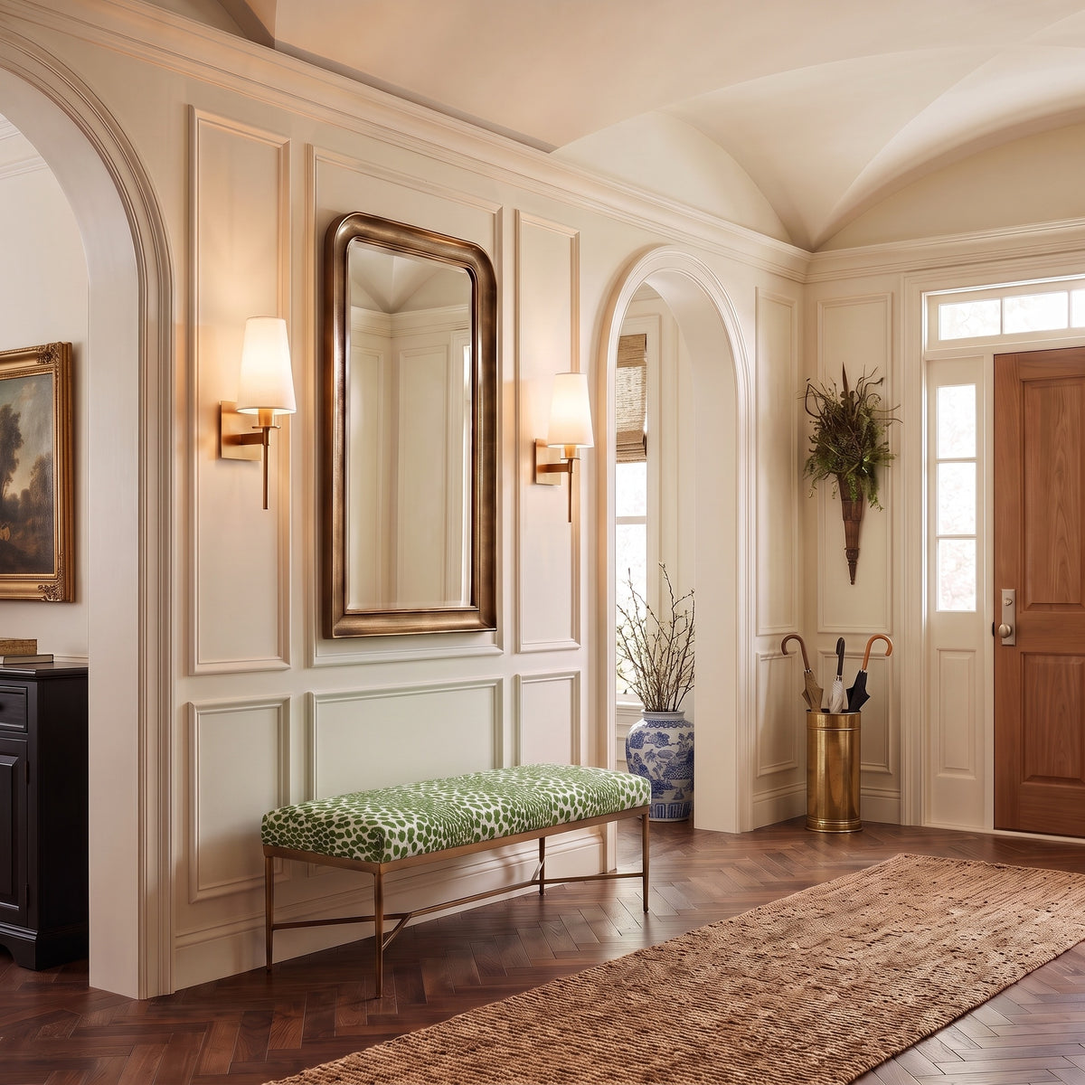 Boca Shaded Wall Sconces in Lacquered Burnished Brass in an entry hall