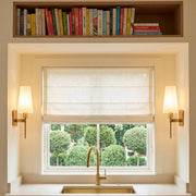Boca Frosted Glass Wall Sconces in Lacquered Burnished Brass over a kitchen sink