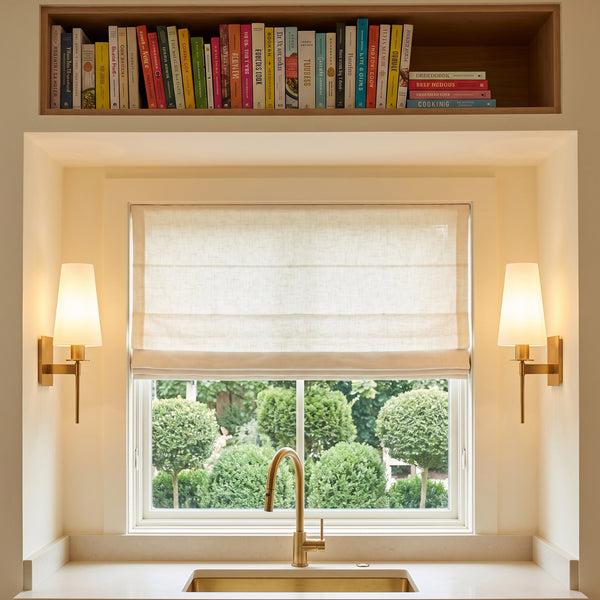 Boca Frosted Glass Wall Sconces in Lacquered Burnished Brass over a kitchen sink
