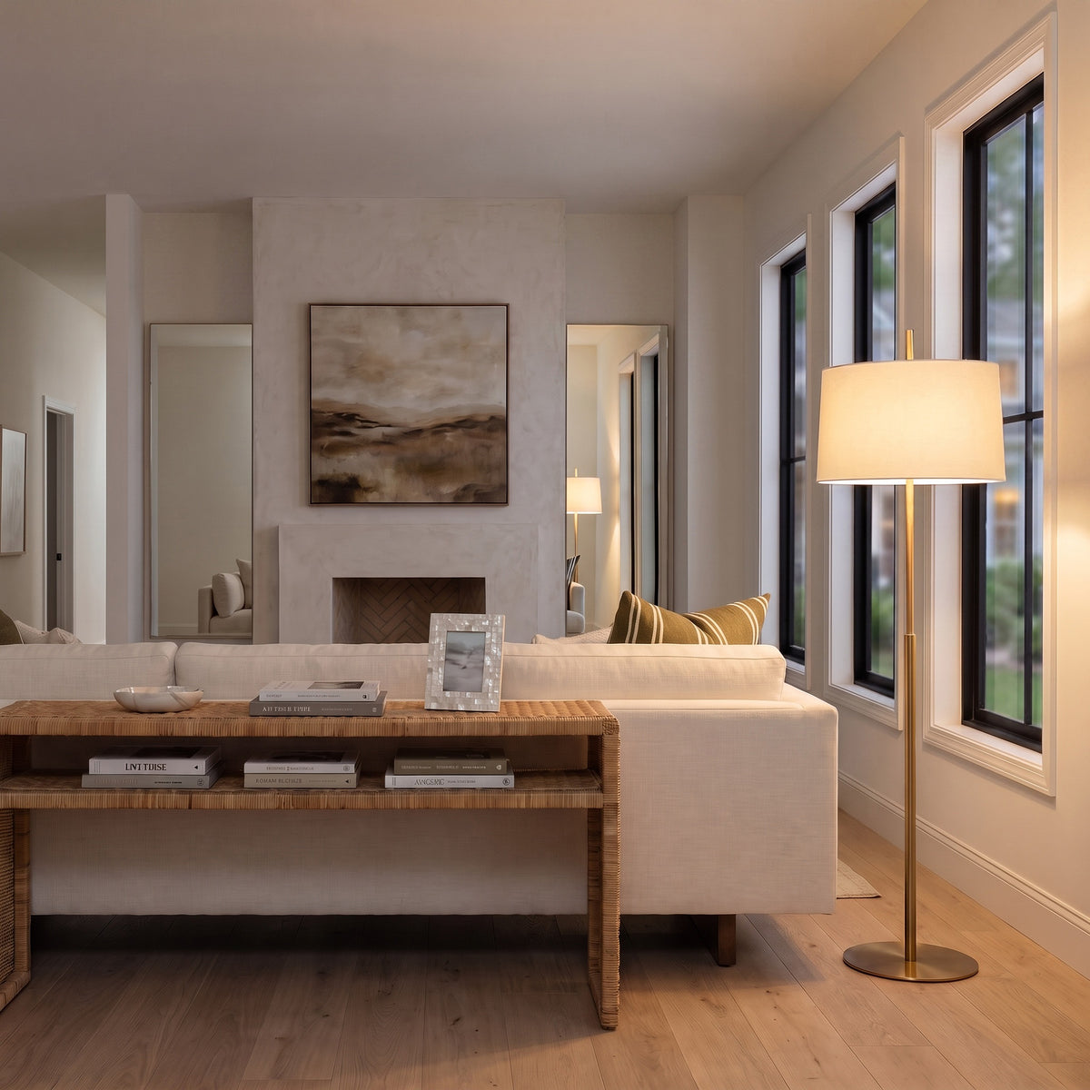Novara Floor Lamp in Lacquered Burnished Brass in a living room