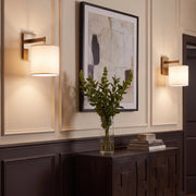 Novara Wall Sconces in Lacquered Burnished Brass above a console