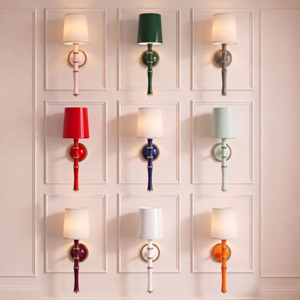 Nine colorful wall sconces arranged in a three-by-three grid on a softly lit paneled wall